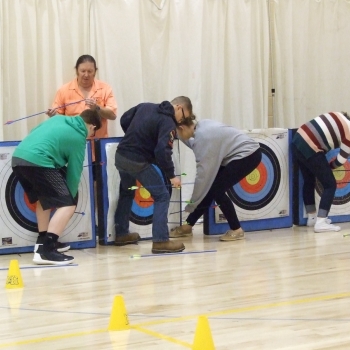 Students retrieving arrows