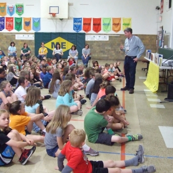 Photo of students with author