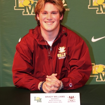 athlete smiling at his signing