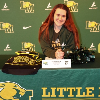 athlete smiling at her signing