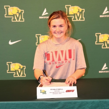 athlete smiling at her signing