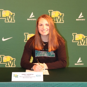 athlete smiling at her signing