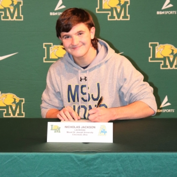 athlete smiling at his signing