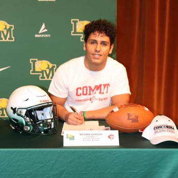 athlete smiling at his signing