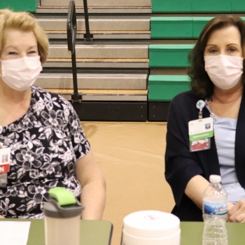 Mercy Health vaccinators smile at staff vaccination