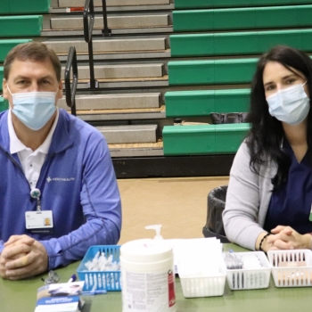 Mercy Health vaccinators smile at staff vaccination