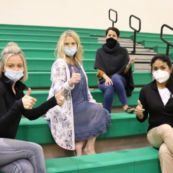 LM Staff members give a "thumbs up" after their vaccine