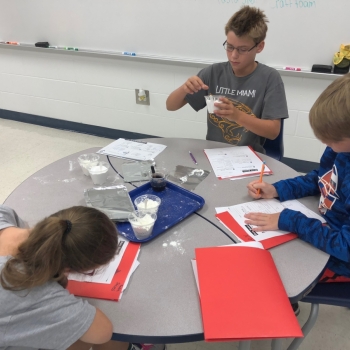 Photo of students testing powder