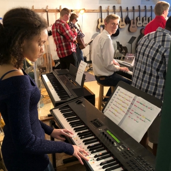 photo of student playing keyboard