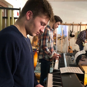 photo of student playing keyboard