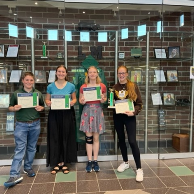 students smiling holding certificate