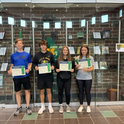 students smiling holding certificate