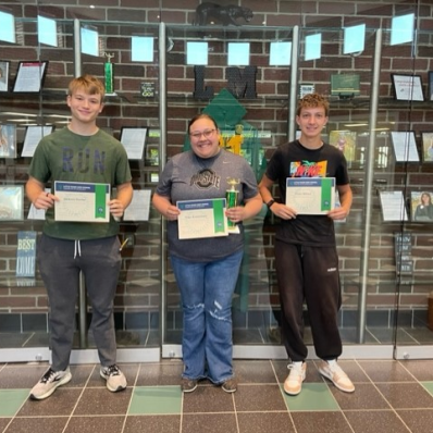 students smiling holding certificate