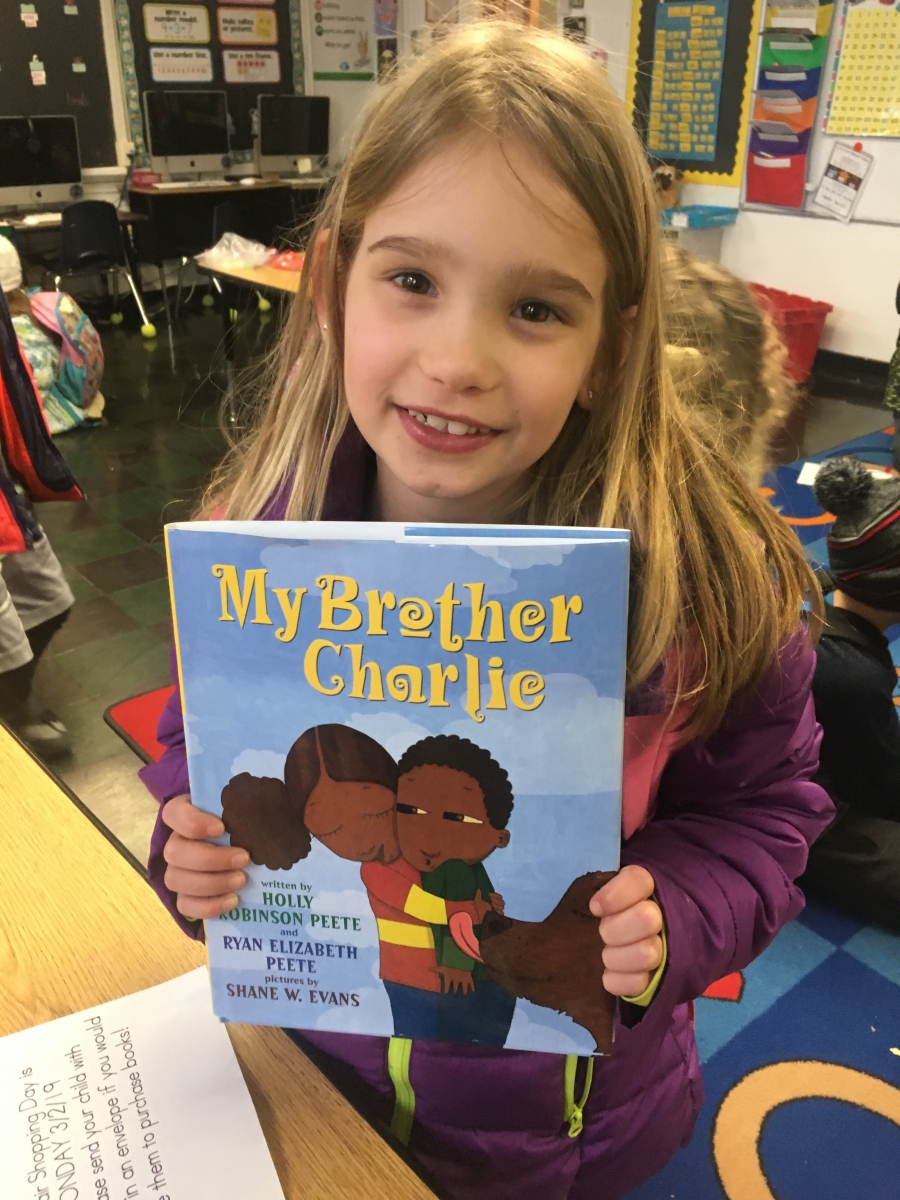 Photo of student with book