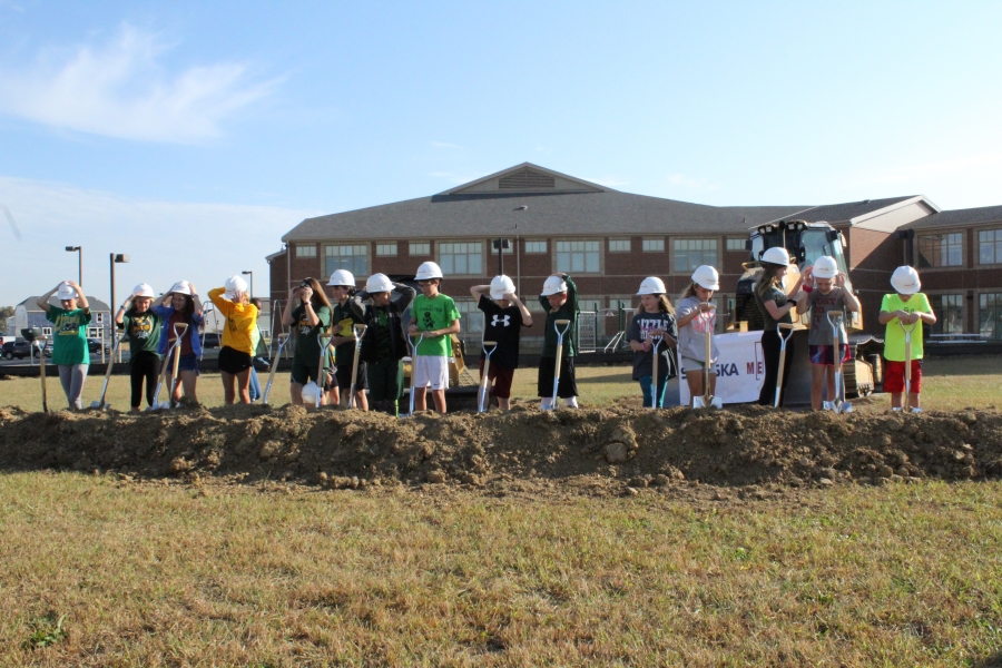 photo of students with shovels