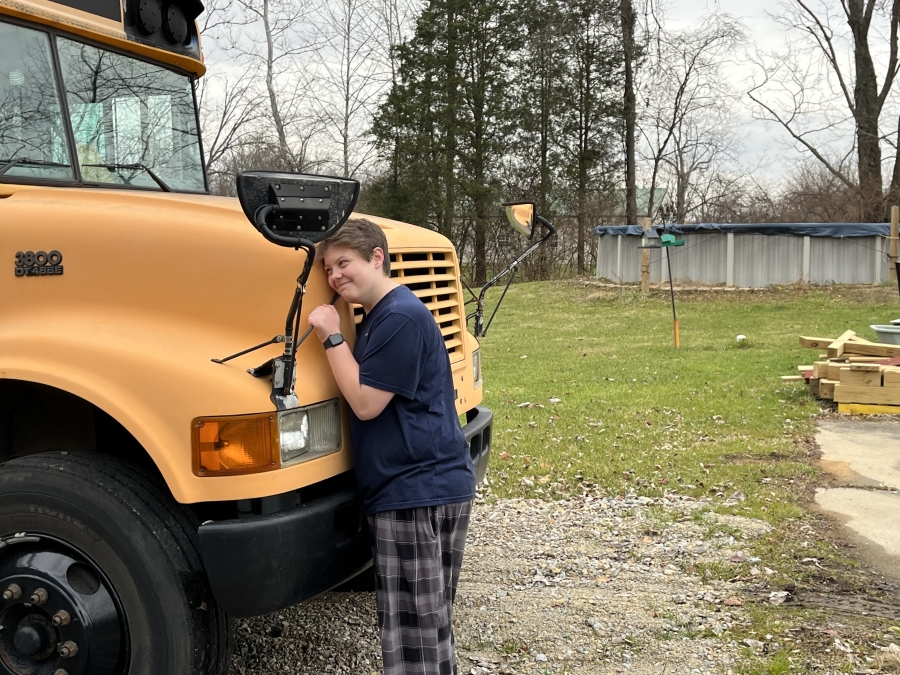 girl hugs bus