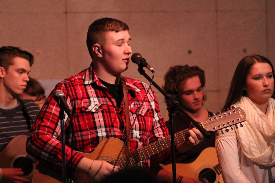 Photo of student with guitar