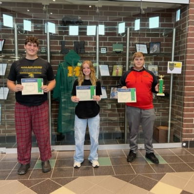 students smiling holding certificate